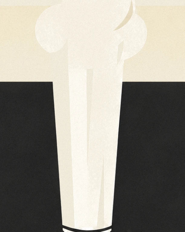 The white chef's hat, puffy and pleated, against a black slate background and cream band