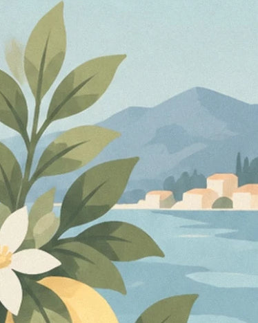 Flowering branches in front of a stretch of blue water, pale houses and mountains