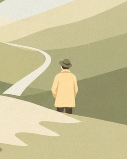 The walker in a yellow coat and hat, seen from behind, facing the path winding through the hills