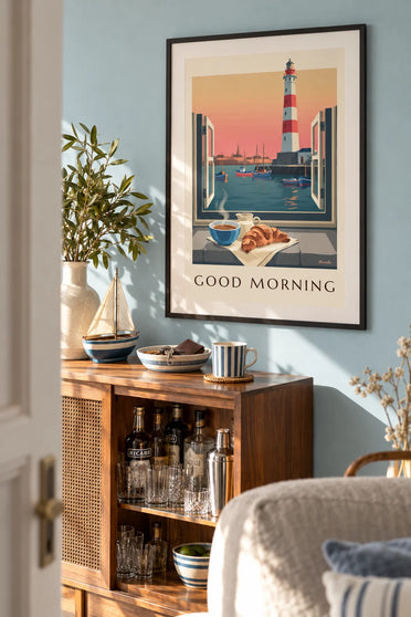 Poster of a coffee bowl and croissant at a window facing the lighthouse: framed on a wall