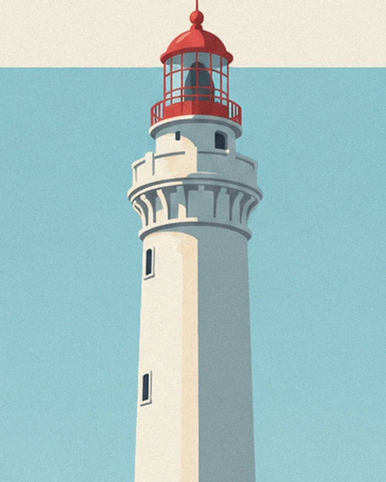 Le phare blanc du Cap Ferret et sa lanterne rouge sur fond de ciel bleu