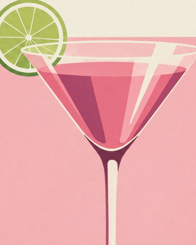 Le verre à cocktail rose et sa rondelle de citron vert, sur fond poudré