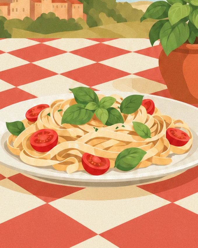 Ein Teller Tagliatelle mit Basilikum und Kirschtomaten auf der rot karierten Tischdecke