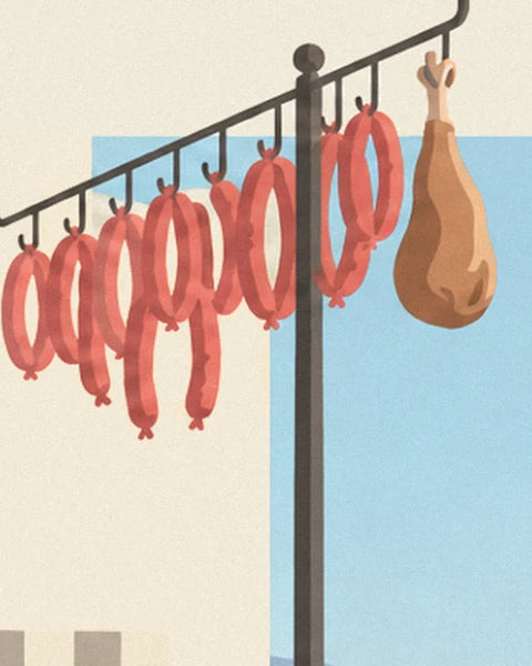 Red sausages and a ham hanging from a hook on their support