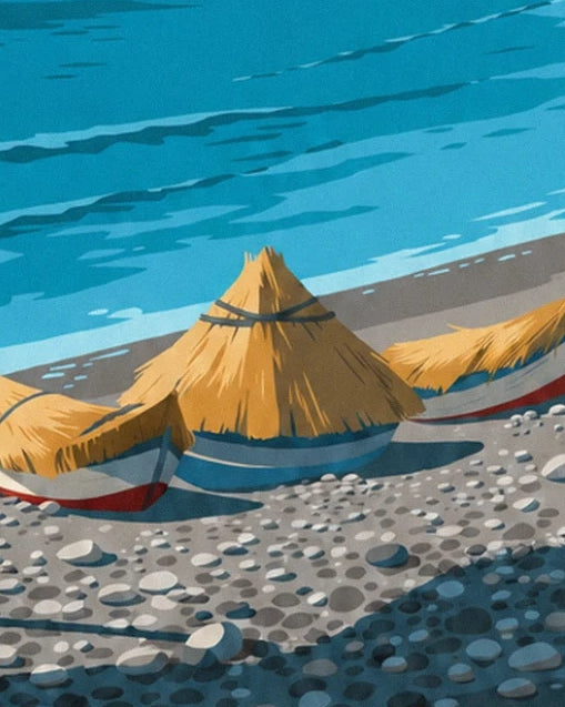 The boat huts with golden thatched roofs on the pebbles, beside the turquoise sea