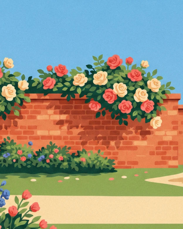The brick wall covered in red and cream roses, and the sandy path beside the flower bed