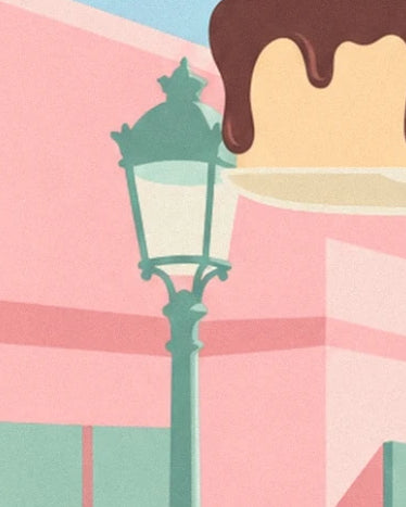Die grüne Straßenlaterne vor der rosa Fassade, neben der schokoladenüberzogenen Torte