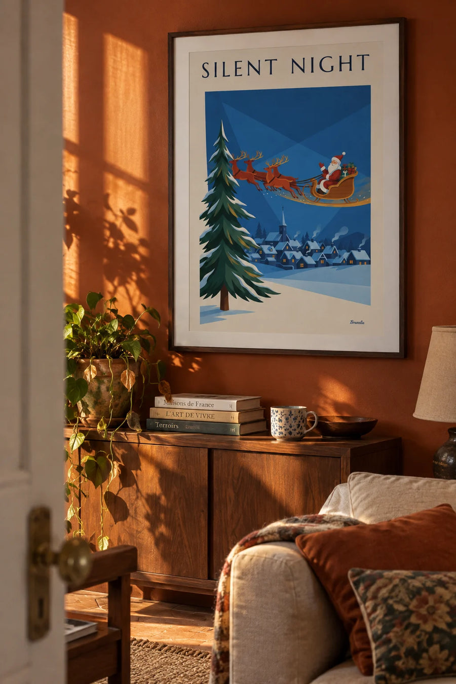 Santa Claus on his sleigh above a snowy village poster: framed on the wall