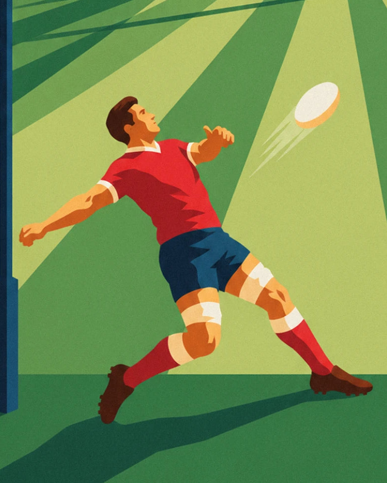 The kicker in a red shirt and blue shorts, arms outstretched, watching his ball