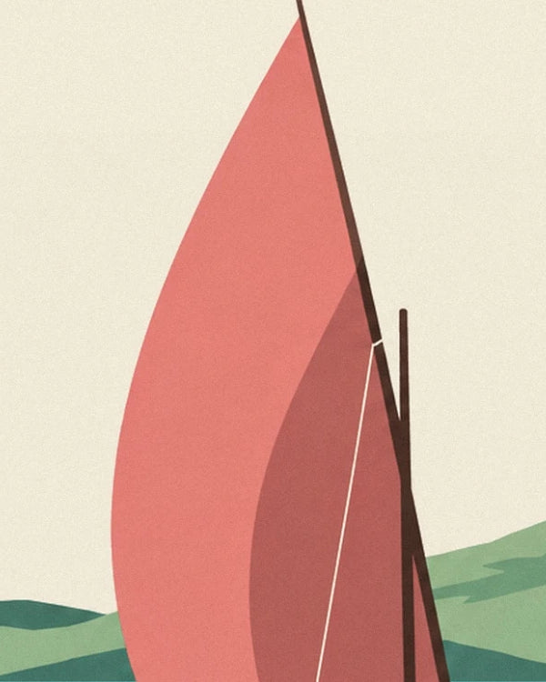 La grande voile corail gonflée par le vent et ses cordages clairs