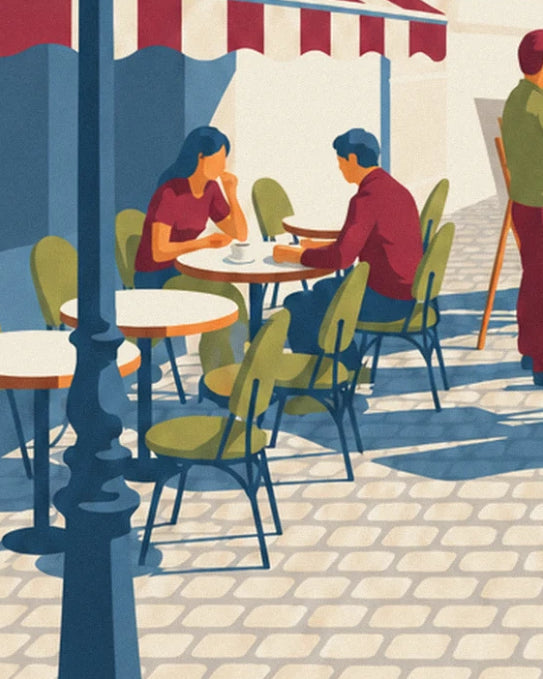 Ein Paar sitzt an einem Tisch der Café-Terrasse unter der rot-weiß gestreiften Markise, nahe der Straßenlaterne
