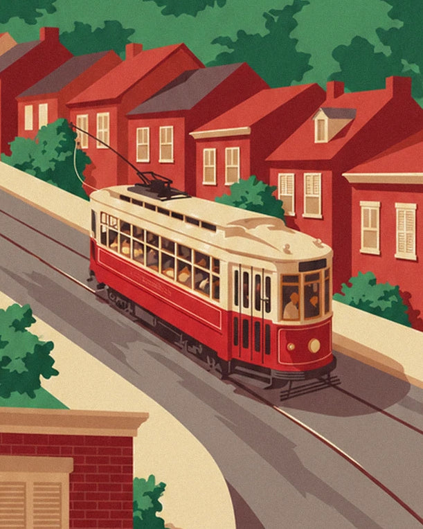 Le tramway rouge et crème qui descend la rue, devant les maisons de brique rouge