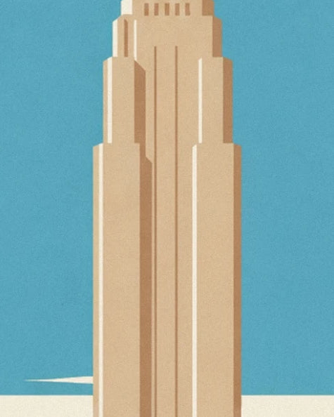 Ein schlanker beiger Turm vor dem blauen Himmel von Manhattan