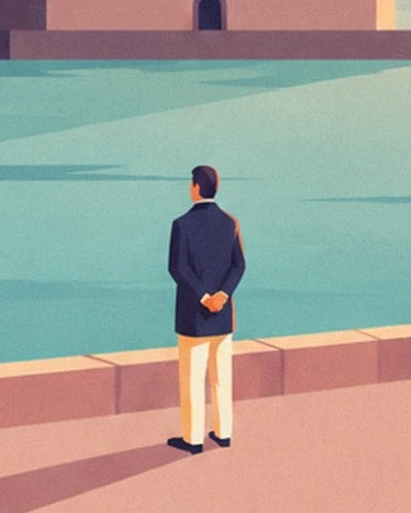 A man in a dark jacket and light trousers, hands behind his back, facing the water