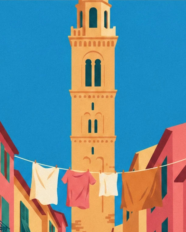 The ochre bell tower against the blue sky, behind a line of colourful laundry