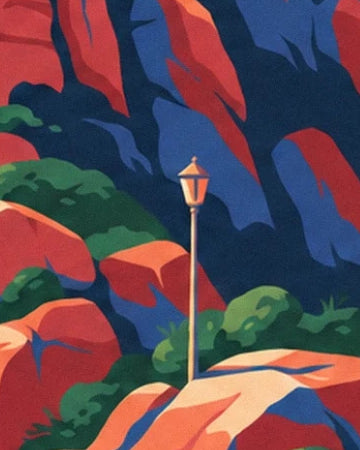 A golden street lamp among red rocks and green bushes