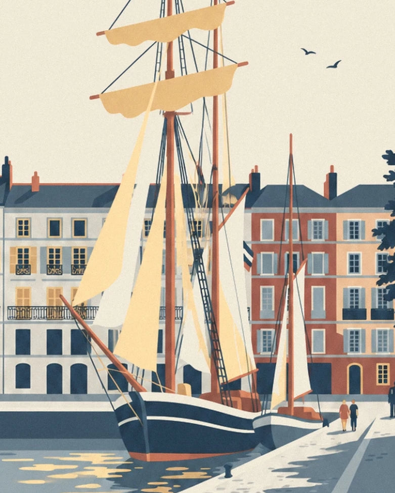 Les voiliers aux voiles crème devant les façades colorées du quai de la Fosse