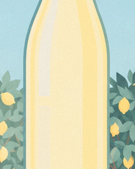 The pale yellow lemonade bottle surrounded by leaves and lemons