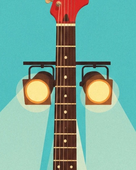 The neck of the red guitar between 2 yellow spotlights with bright beams