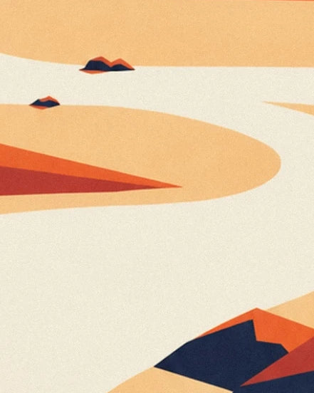 Curves of cream and orange sand dotted with dark rocks in the desert