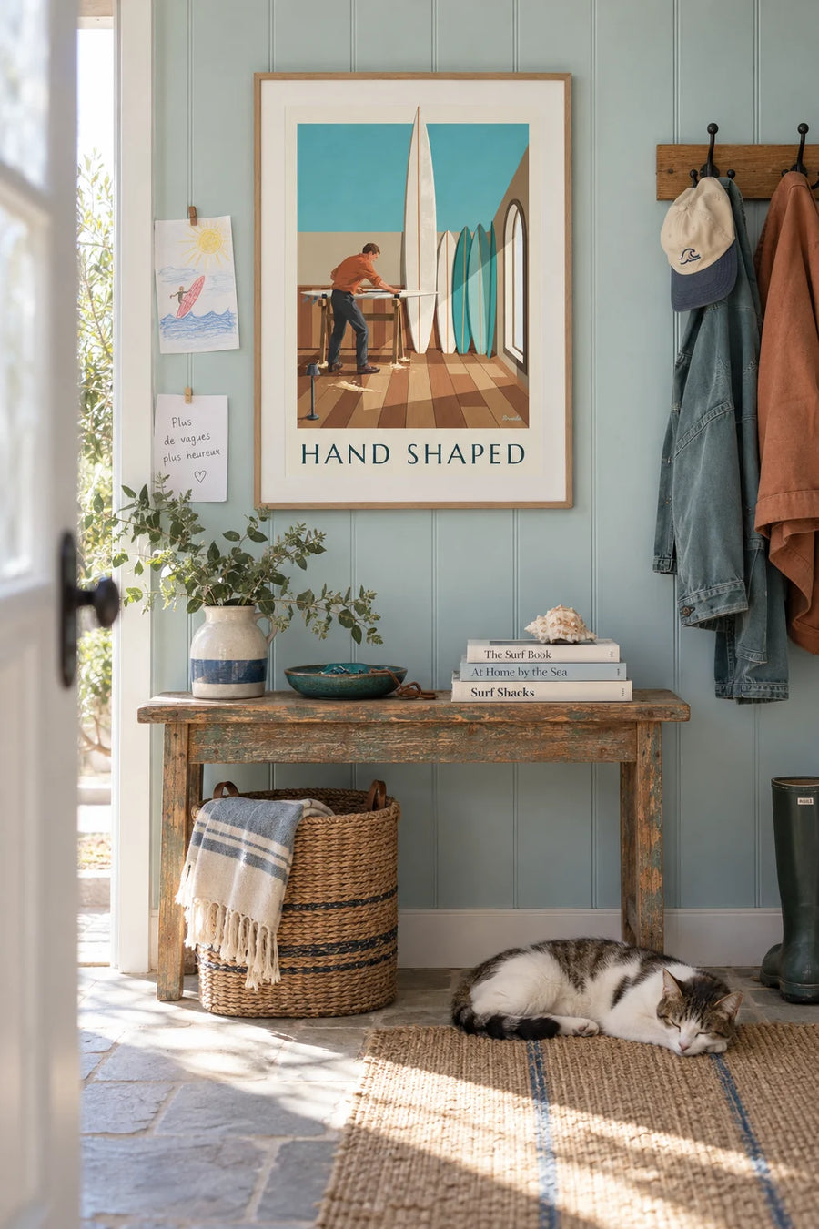 Poster of a shaper sculpting a surfboard in his workshop: framed on the wall