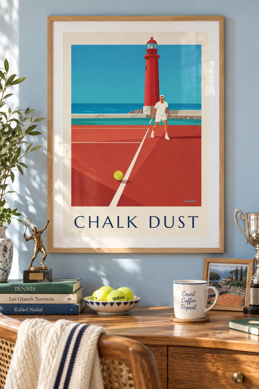 Poster of a tennis ball on the line and an astonished player near the lighthouse: framed on the wall