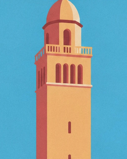 The ochre bell tower with its rounded top and balustrade against the blue sky