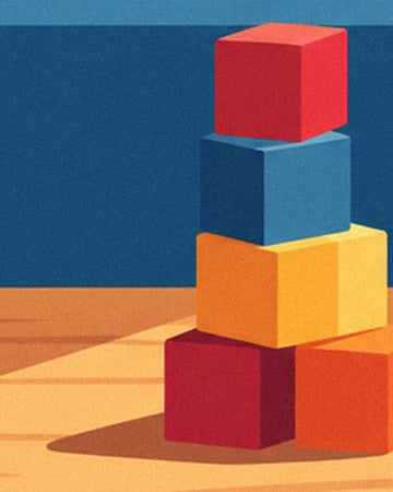 Une pile de cubes rouges, bleu et jaune sur le parquet du magasin de jouets