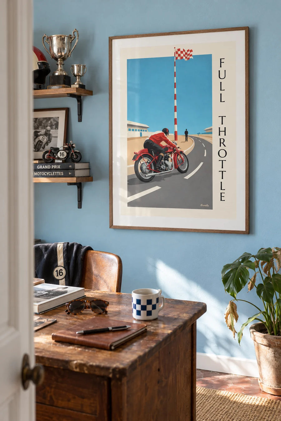 Poster of a racing motorcycle leaning into a Grand Prix turn: framed on the wall