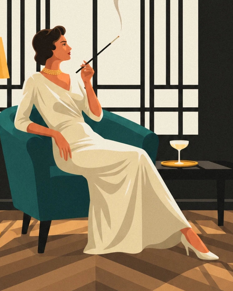A woman in an ivory dress, holding a long cigarette holder in a teal armchair