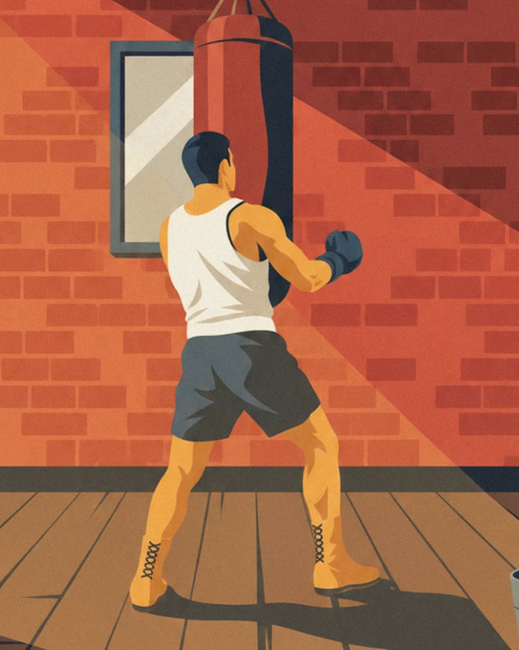 The boxer in a white vest and grey shorts facing the red punchbag beside a mirror