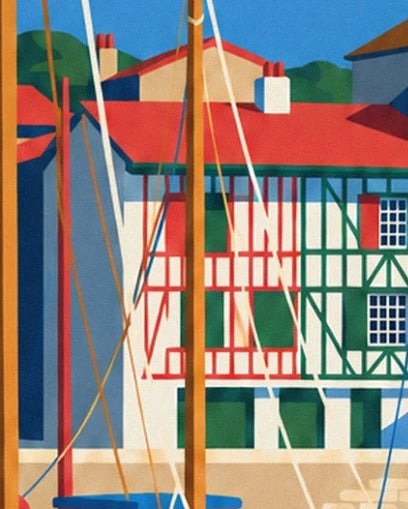 The Basque façades with red and green timber framing behind the masts and rigging
