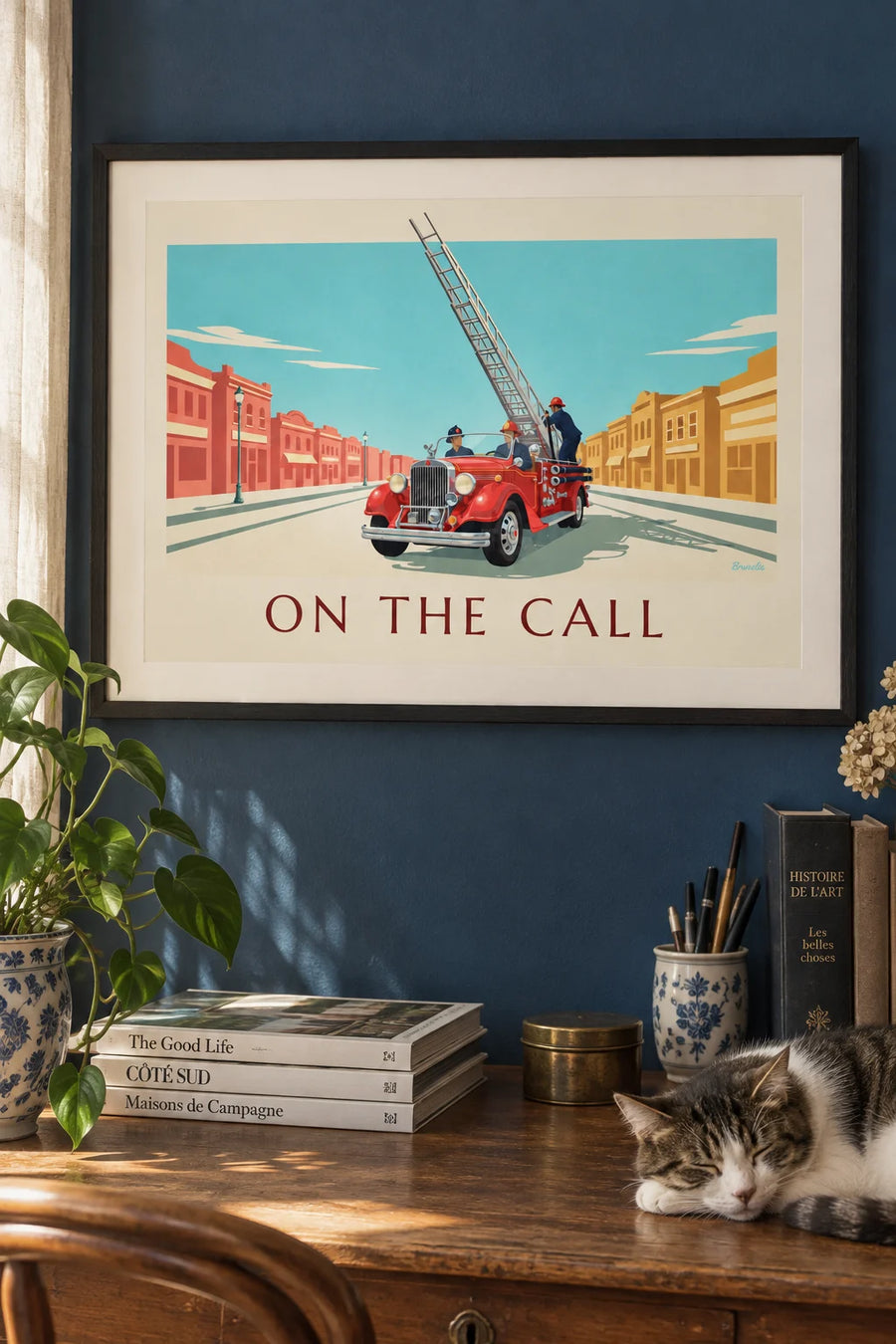 Poster of a red fire truck with an aerial ladder in action: framed on the wall