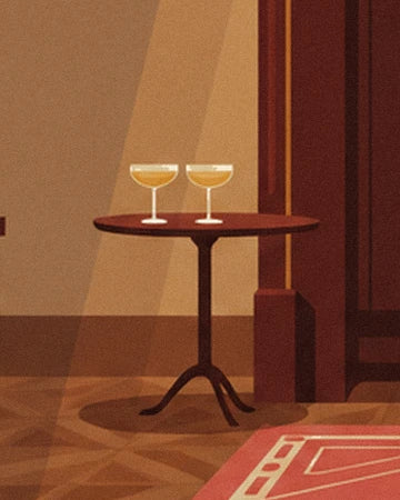 The 2 stemmed glasses on a small round wooden table at the edge of the red rug