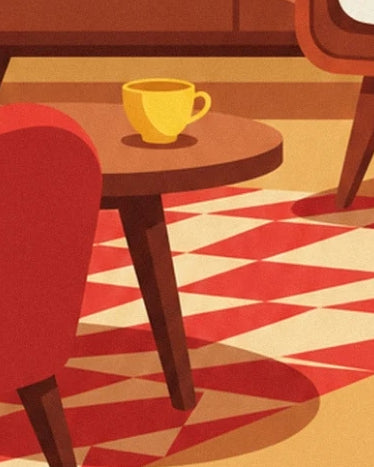 La tasse jaune sur la table basse brune, entre le fauteuil rouge et le téléviseur