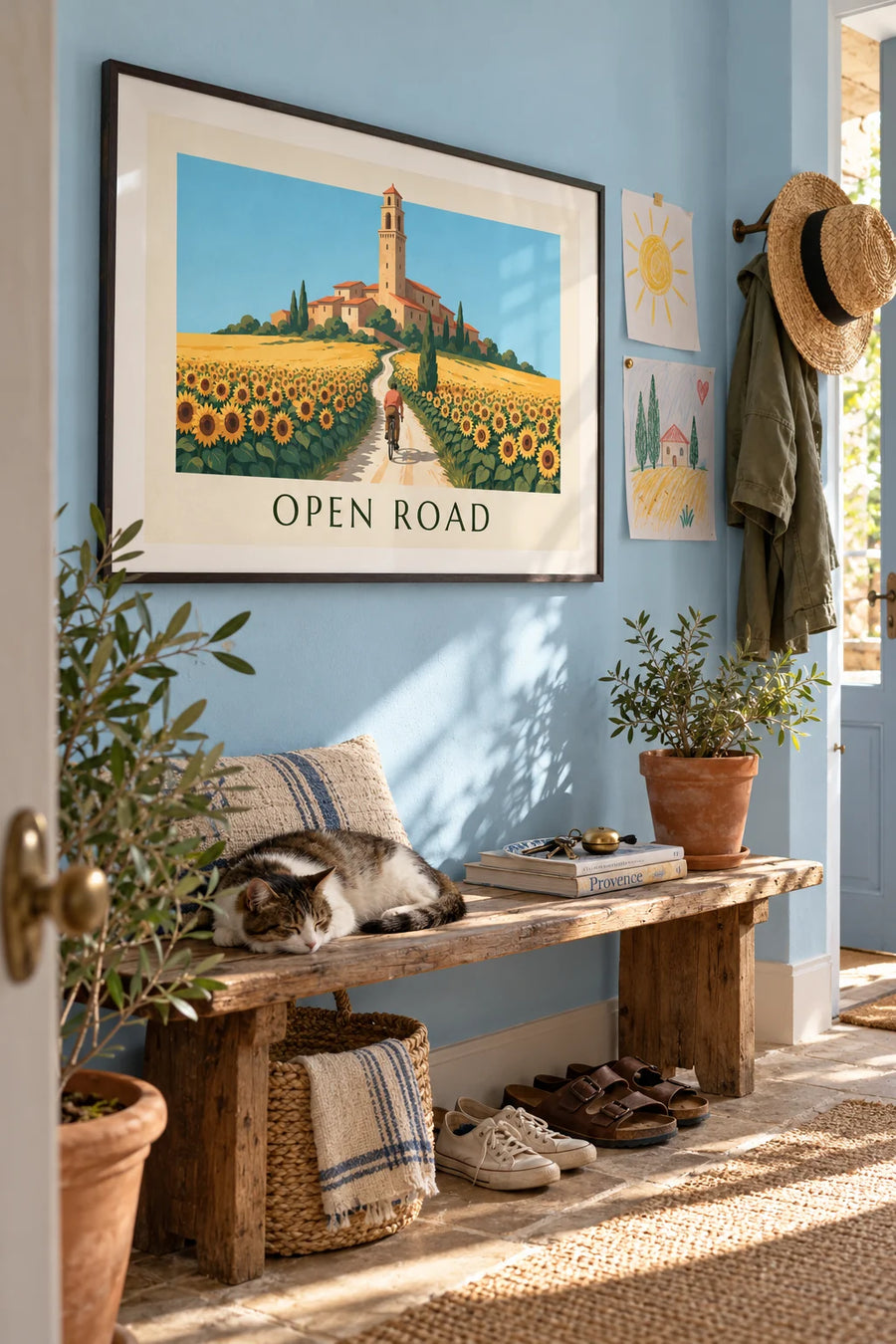 Cyclist among sunflowers heading to a hilltop village poster: framed on the wall