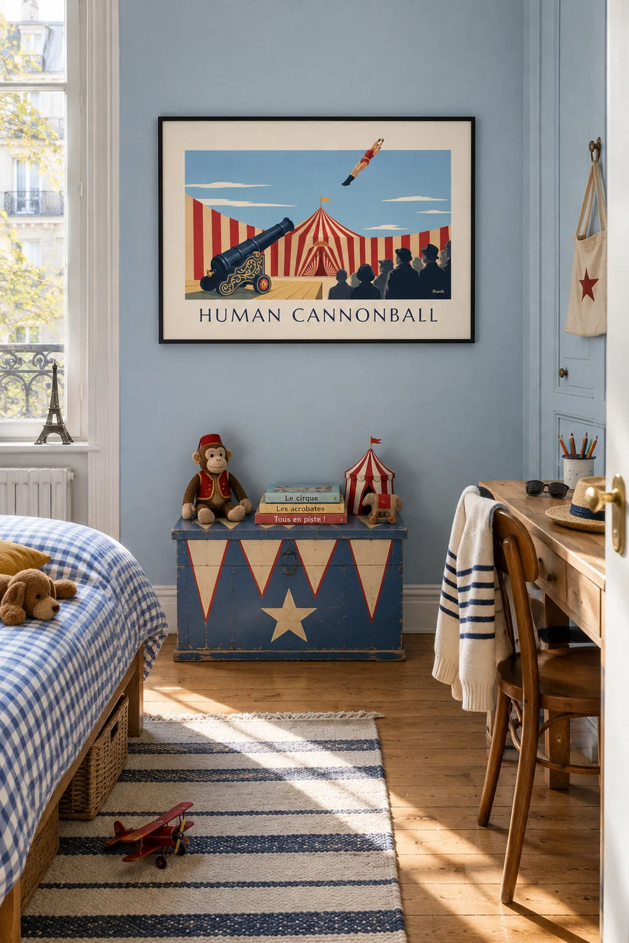 Poster of a human cannonball launched under the big top: framed on the wall