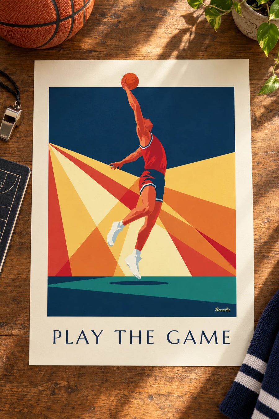 Poster of a basketball player mid-dunk against a backdrop of rays: placed on a table