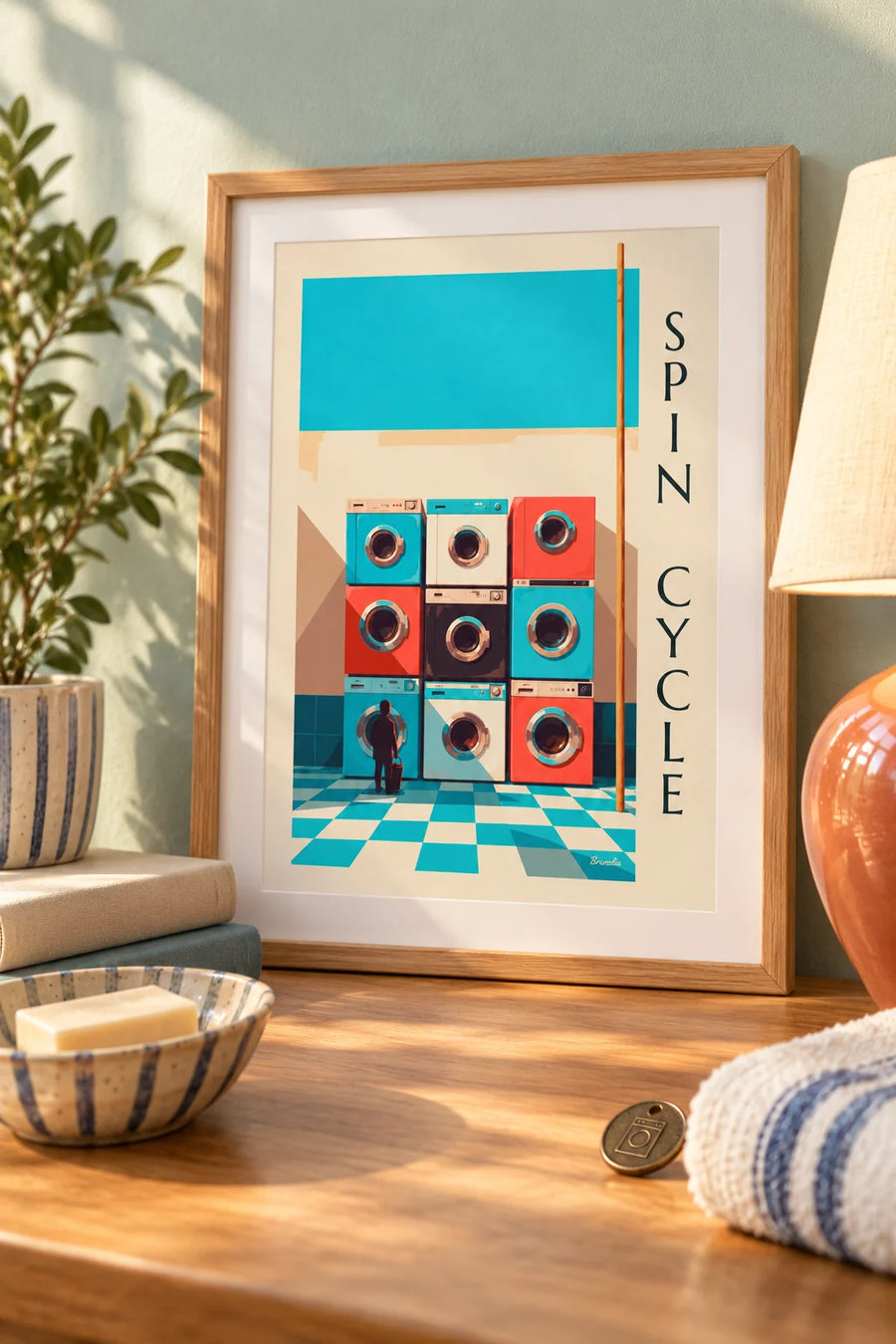Poster mit 9 bunten Waschmaschinen im Raster : kleines A4-Format, gerahmt