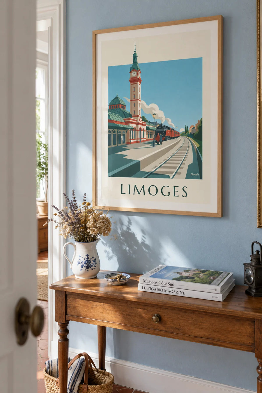 Poster of a train and the Limoges-Bénédictins station: framed on the wall