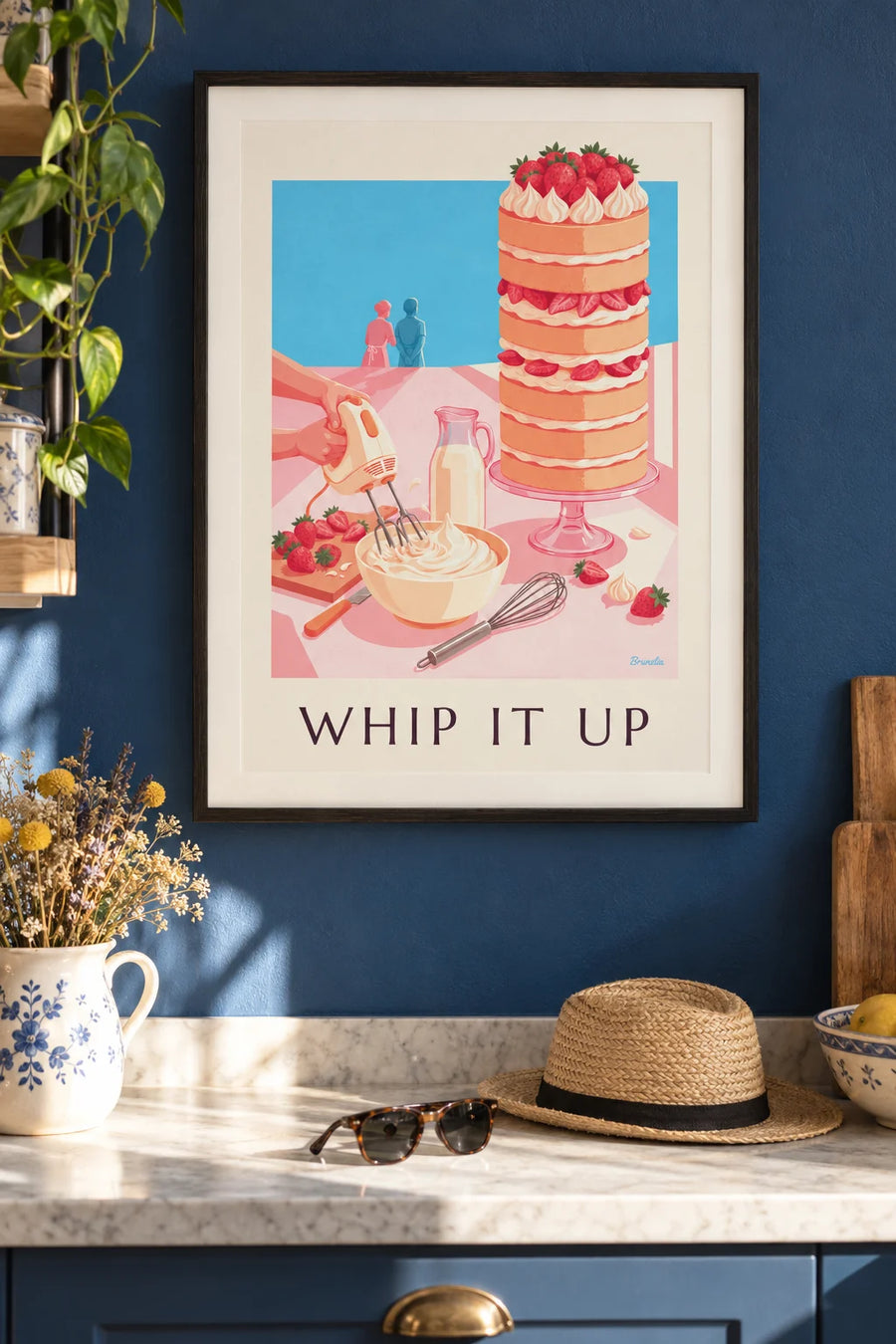 Hand mixer, whipped cream and strawberry cake poster: framed on the wall