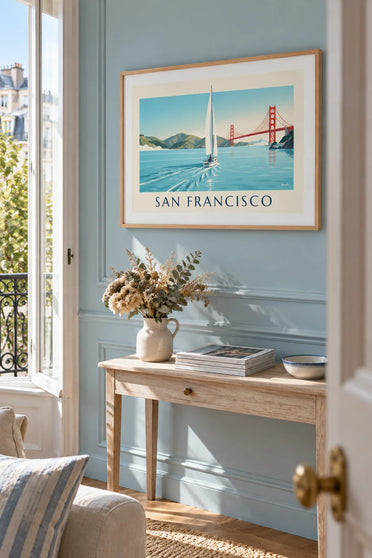 Poster of a white sailboat in San Francisco Bay: framed on the wall