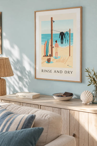 Poster of a beach shower and surf wetsuits drying: framed on the wall